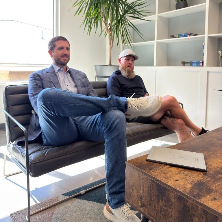 Hire Truckers teammates talking in the office