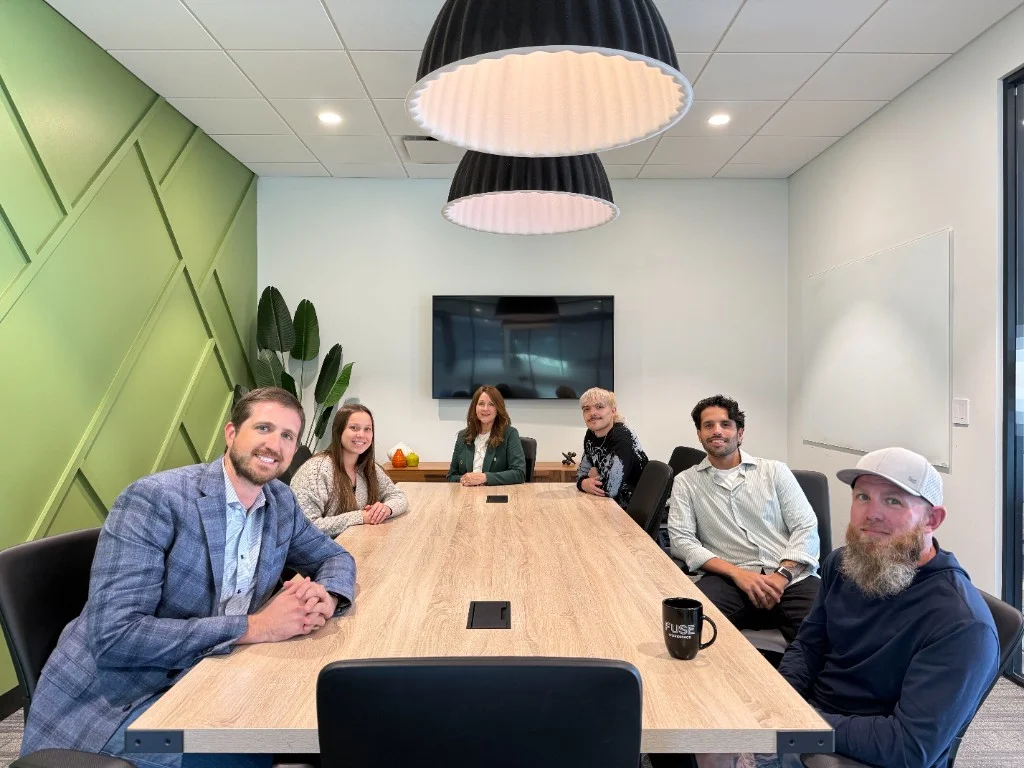 Hire Truckers team gathered around a conference table